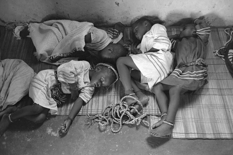 Children asleep after all night vigil. 1982