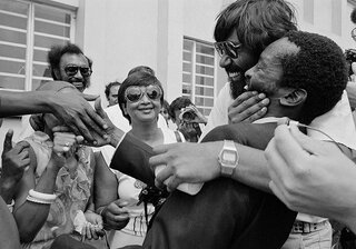 Dr. Aubrey Mokoape greeted by Strini Moodley on his release from Robben Island. Durban Central Prison. 1982